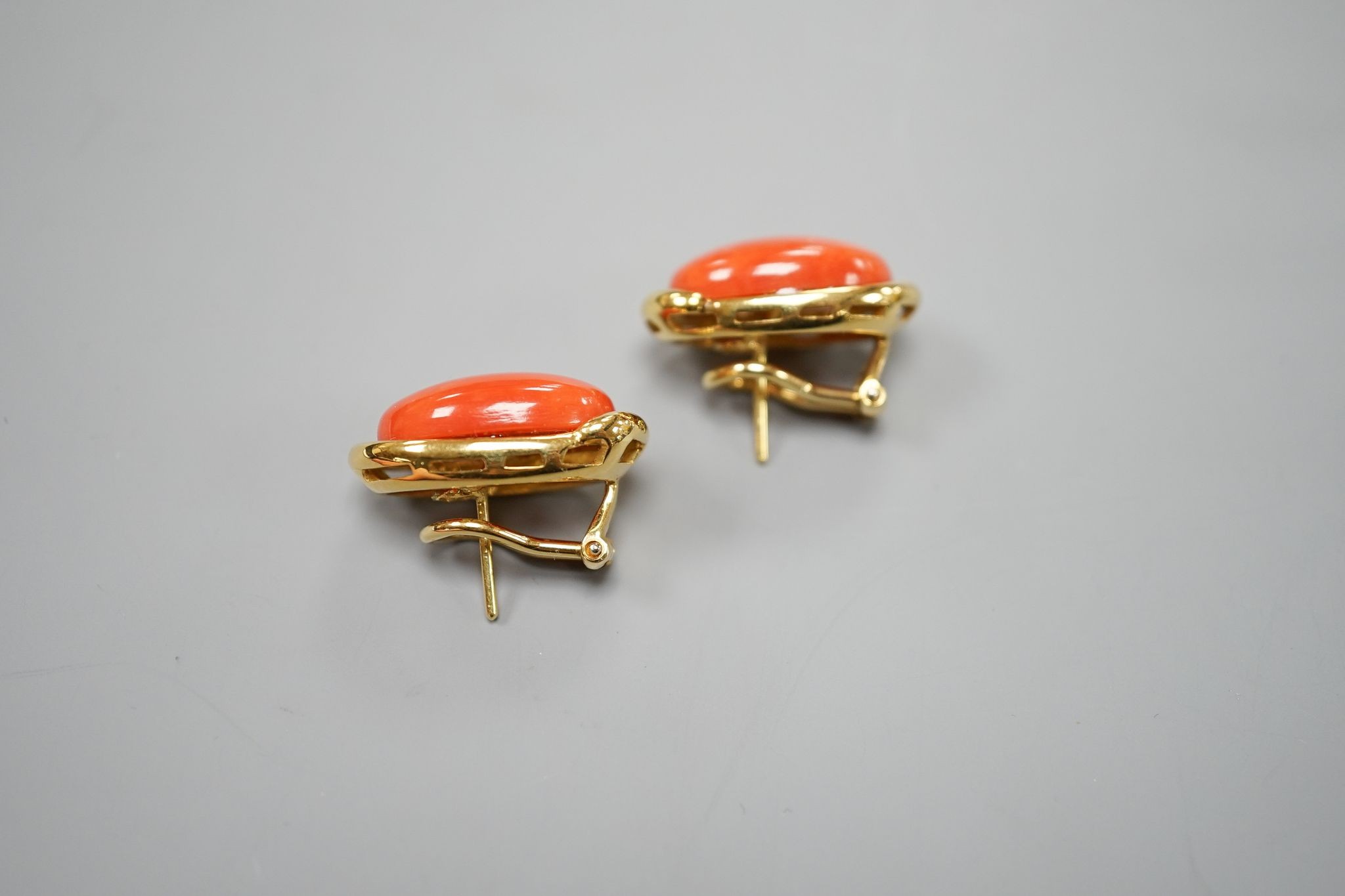 A pair of modern Italian 750 yellow metal and oval coral bead set earrings, 22mm, gross weight 17.2 grams.